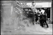 National Front Marchers and police get pelted by anti fascists with building site debris while marching through an Asian community in  Leicester.  21_04_1979.