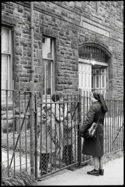 Nun visiting residents of Haldane Building, in Hill Street
